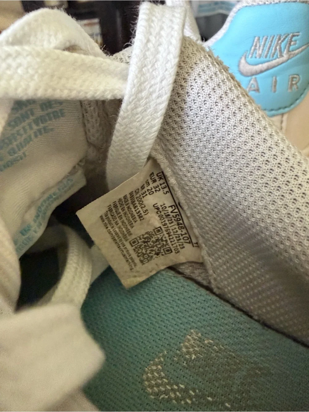 Nike Kids White Sneakers with Light Blue Swoosh